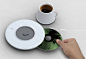 Musical Teacup - 音乐茶杯 
The Drip with Song，来自韩国设计师 Jongmin Kim 的精彩创意，杯垫是一个内置音箱的CD播放机，把CD放入吸入式插口，然后通过表面的控制按键即可播放音乐，更独特的地方在于音量的调节：将杯子放在底座上，旋转即可完成对音量的调节。