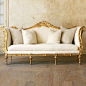 Gold and cream settee.