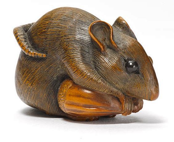 A WOOD NETSUKE OF A ...