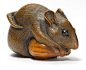 A WOOD NETSUKE OF A RAT WITH A CHESTNUT By Mitani Goho, Iwami, Edo period (19th century) Sold for US$ 47,500 inc. premium