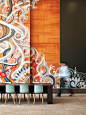 SKB Architects Creates Lively Lobby for Key Center Office Tower. In the Key Center lobby, SKB artist/muralist Jonathan Wakuda Fischer spray-painted a mural on existing maple paneling.