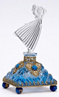 CZECH Perfume bottle in blue and clear crystal with enameled and jeweled filigree metalwork, dancer stopper with dauber, 1920s.