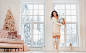 Beautiful young girl in white dress posing on camera. Christmas concept