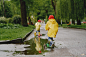 Funny kids in rain boots playing with skates