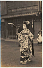 Young girl playing battledore and shuttlecock, ca. 1900-1906