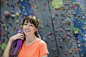 Portrait of woman holding climbing rope at gym - stock photo