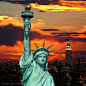 晚霞中美国纽约自由女神高清背景桌面图片素材