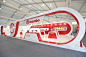 BREMBO, Autoshow Beijing : The Brembo stand has been thought as a box that opens itself on the audience on the two sides. All the components have been designed with order and homogeneity, to reflect the fluency of the Brand approach to the way of thinking