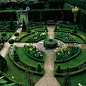 Abbeey House in Wiltshire. Round garden with a geometric shape, carefully pruned hedges, and symmetrical colors.: