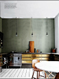 slate-green wall color with brass cabinets — kitchen: 