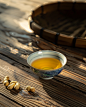 Chinese atmosphere product photography, a bowl of cooking oil on a wooden table with a few peanuts next to it, photography, --v 6.0 --ar 4:5