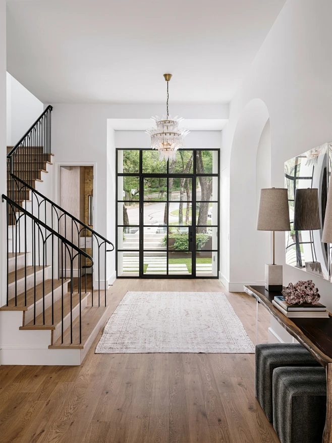 Example of a large tuscan light wood floor and beige floor entryway ...