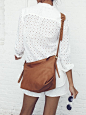 Madewell tunic popover worn with eyelet shorts + the Sutton hobo.