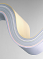 Multi coloured pile of curved paper, close-up