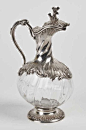Petite aiguière monture argent à décor de rinceaux, prise du couvercle branche. Poids brut: 434 g - Pescheteau-Badin - 28/10/2014