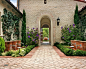 This is an example of a mediterranean courtyard garden in Los Angeles with with a water feature.