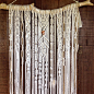 Medium Macrame Wall Hanging. Shells, Pukas, sisal twine, feathers. : Medium handmade macrame wall hanging, made with natural cotton cord. Details feature feathers, shells, pukas, sisal twine. This beautiful macrame hangs from a unique driftwood found on a