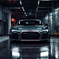 head on front view of a 2016 audi r8 v10 plus parked in a garage with neon lights