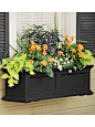 3ft. Fairfield Self Watering Windowbox Planters | Buy from Gardener's Supply...The Fairfield Windowbox features chartreuse devil's ivy (pothos), orange firecracker flower (Crossandra infundibuliformis), dracena spikes, purple ornamental peppers and white 