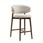 MATTEO BAR STOOL :  The embodiment of comfort and class, the Matteo bar stool is a nordic-inspired design full of Scandinavian style. The wooden base of this stool is curved in a thick frame which contrasts beautifully with the boucle upholstery, adding t