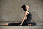 Young woman doing single pigeon exercise Free Photo