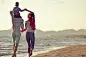 portrait of happy family and baby enjoying sunset in the summer leisure