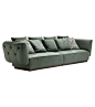 Simon Opera Contemporary Sofa Simon designed by Castello Lagravinese Studio for Opera Contemporary is an elegant sofa with wooden structure and upholstery available in fabric or leather. It's distinctive feature is the refined capitonnè work featured on r
