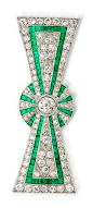 An art deco diamond and emerald bow brooch, circa 1925 The stylised ribbon bow with pierced and millegrain detail, set throughout with rows of old brilliant-cut diamonds and french-cut emeralds, a larger collet-set old brilliant-cut diamond at the centre,