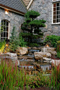 Rustic Landscape/Yard with Ozark/fieldstone 10 sq ft flat, Custom medium in-ground waterfall and pond, exterior stone floors