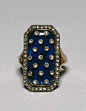 In the late 18th century and into the 19th century, marquise rings set with diamonds on dark blue or red enamel backgrounds became fashionable in Europe. The oval (marquise bezel), like this ring, and the rectangular (shuttle-shaped bezel) were the most p