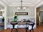 Elegant medium tone wood floor and brown floor enclosed dining room photo in San Francisco with gray walls