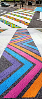 Using a bright range of colours to draw contrast against the dull & dark pavement could be an effective way to create a visual representation of  positivity.: 