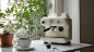 ls7623_A_white_cafe_machine_with_white_cups_and_coffee_grinds_o_40fc3723-0d7d-4979-a283-a6e646420523
