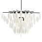 This eight-light chandelier is slightly whimsical. Frosted, seedy glass discs bring a modern feel to this stunning wind chime design. A blackened iron frame anchors the piece while adding a hint of industrialism. Finish may vary. Shown with a clear tubula