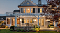 Backyard view of house with various types of windows