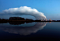 Steam billows from the cooling towers of Vattenfall's Jaenschwalde brown coal power station on a lake near Cottbus, eastern Germany in 2009. (Pawel Kopczynski/Reuters)