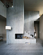 Cool, concrete fireplace in House Müller Gritsch, by Andreas Fuhrimann Gabrielle Hächler Architekten of Zurich