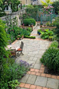 Harpur Garden Images Ltd :: vward1 Small urban town courtyard garden yorkstone terracotta paving slab patio terrace tables chairs dine dining entertain design division screening blue green painted trellis overview room outside outdoor living pots containe