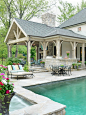 Example of a classic patio design in St Louis with a fire feature
