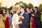 Newlyweds kissing at wedding reception by Half Point on 500px