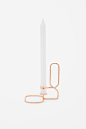 Inspired by a line drawing, this modern candle holder is made from curved copper wire – choose from a triangle or square-shaped base.

100% Metal / Square 10.5 x 14.5 cm / Product number 896930-04