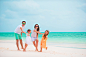 Happy young family on beach vacation by Dmitry Travnikov on 500px