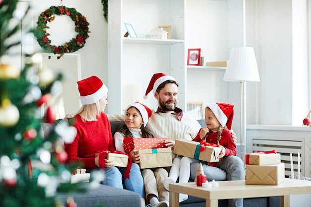 Happy family sitting...