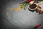 spices and herbs over black stone background, top view with copy by dziewul on 500px