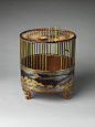 Japanese Bird Cage - 18th C. /  Black lacquer ground with gold and silver maki-e, dyed wood, and silk netting - The cranes, wheels, and flowing poem scripts decorating this birdcage refer to both Wakanoura, an inlet on the Kii Peninsula revered as the “ba