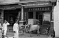 photo454-(ca. 1941) Singapore, oxen and cart hitched in front of China goods store