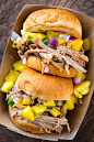 Pressure Cooker Pulled Pork Sandwiches topped with pineapple salsa