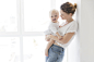 beautiful-mother-holding-baby-girl
