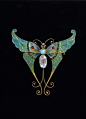 The ultimate in Plique á Jour jewelry, this Boucheron brooch was in the collection of Elizabeth Taylor.   Yummy.