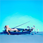 Paper cut image of fisherman relaxing in boat with fishing rod 